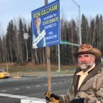 District O State Senate candidate Ron Gilliam holds a sign at the intersection of the Sterling and Kenai Spur Highways on Tuesday, Nov. 6, 2018, in Soldotna, Alaska. (Photo by Victoria Petersen/Peninsula Clarion)