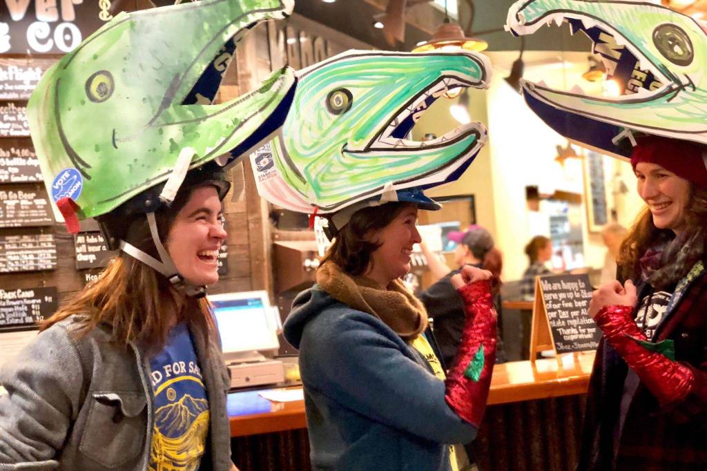 Kaitlin Vadla and supporters of Alaska Ballot Measure 1 gather at Kenai River Brewing Company for a Stand for Salmon event Tuesday evening, on Nov. 6, 2018, in Soldotna, Alaska. (Photo by Victoria Petersen/Peninsula Clarion)