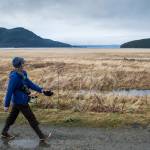 Laurie Lamm takes an exercise break on her lunch hour along the Airport Dike Trail on Thursday. (Michael Penn | Juneau Empire)