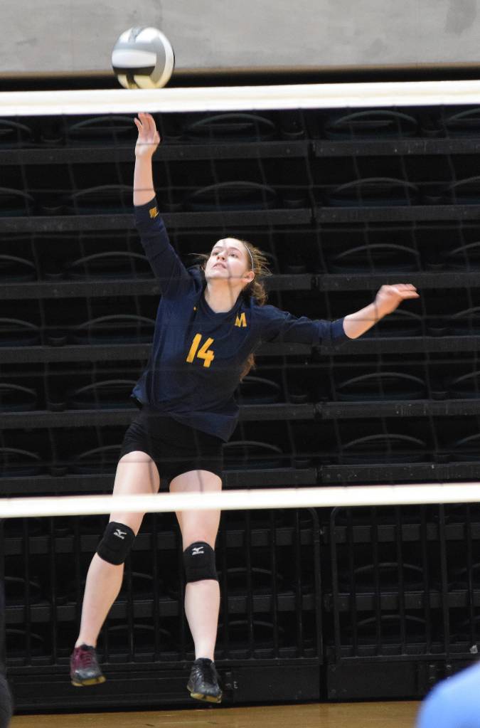 Homers Laura Inama saves a ball Thursday against Valdez at the Class 3A state volleyball tournament at the Alaska Airlines Center. (Photo by Joey Klecka/Peninsula Clarion)