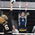 Soldotna senior Carsen Brown (2) blocks a shot from Colonys Marett Mollnow (6) Friday afternoon at the Class 4A state volleyball tournament at the Alaska Airlines Center. (Photo by Joey Klecka/Peninsula Clarion)