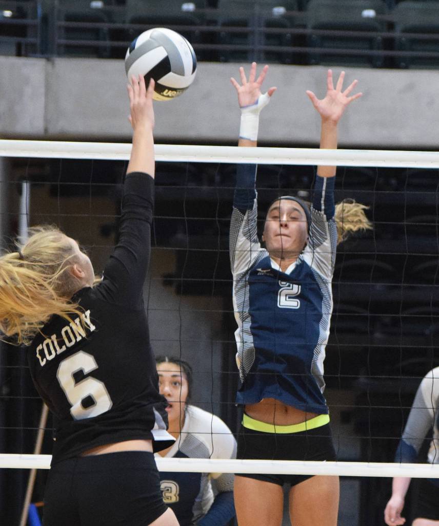 Soldotna senior Carsen Brown (2) blocks a shot from Colonys Marett Mollnow (6) Friday afternoon at the Class 4A state volleyball tournament at the Alaska Airlines Center. (Photo by Joey Klecka/Peninsula Clarion)