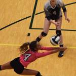 Soldotnas Holleigh Jaime dives for a ball with teammate Kodi McGillivray (4) watching Friday afternoon against Colony at the Class 4A state volleyball tournament at the Alaska Airlines Center. (Photo by Joey Klecka/Peninsula Clarion)