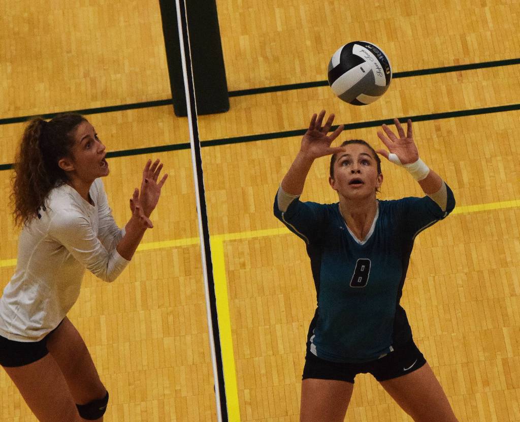 Nikiskis Kaitlyn Johnson sets up a shot Friday afternoon against Grace Christian at the Class 3A state volleyball tournament at the Alaska Airlines Center. (Photo by Joey Klecka/Peninsula Clarion)