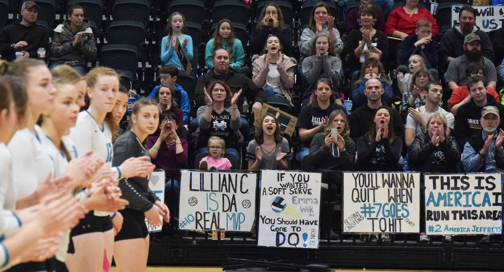 Nikiski volleyball fans cheer during pregame introductions Saturday before the Class 3A state volleyball championship final against Valdez at the Alaska Airlines Center. (Photo by Joey Klecka/Peninsula Clarion)