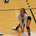 Nikiskis Emma Wik sets up a shot Saturday in the Class 3A state volleyball championship final against Valdez at the Alaska Airlines Center. (Photo by Joey Klecka/Peninsula Clarion)