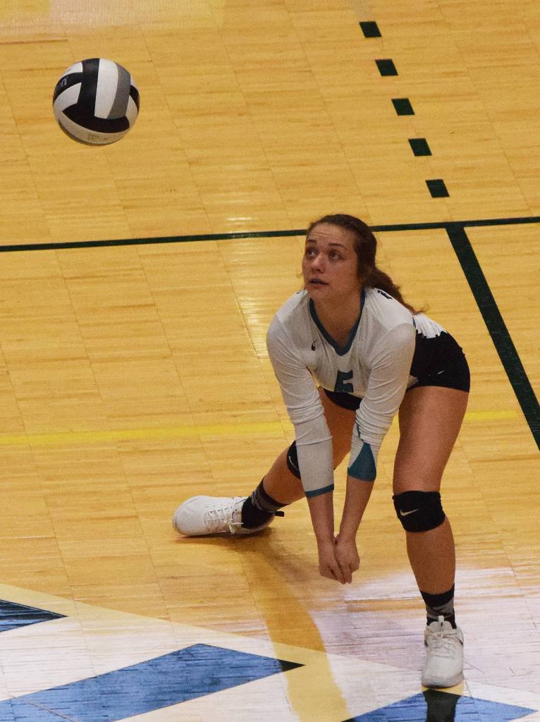 Nikiskis Emma Wik sets up a shot Saturday in the Class 3A state volleyball championship final against Valdez at the Alaska Airlines Center. (Photo by Joey Klecka/Peninsula Clarion)
