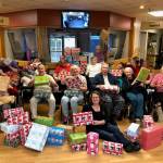 Heritage Place residents wrap holiday boxes with Samaritan’s Purse