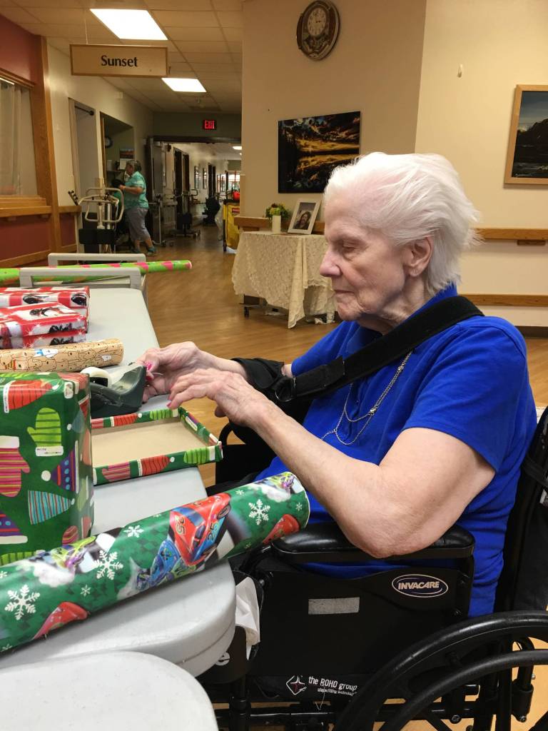 Heritage Place residents wrap holiday boxes with Samaritan’s Purse