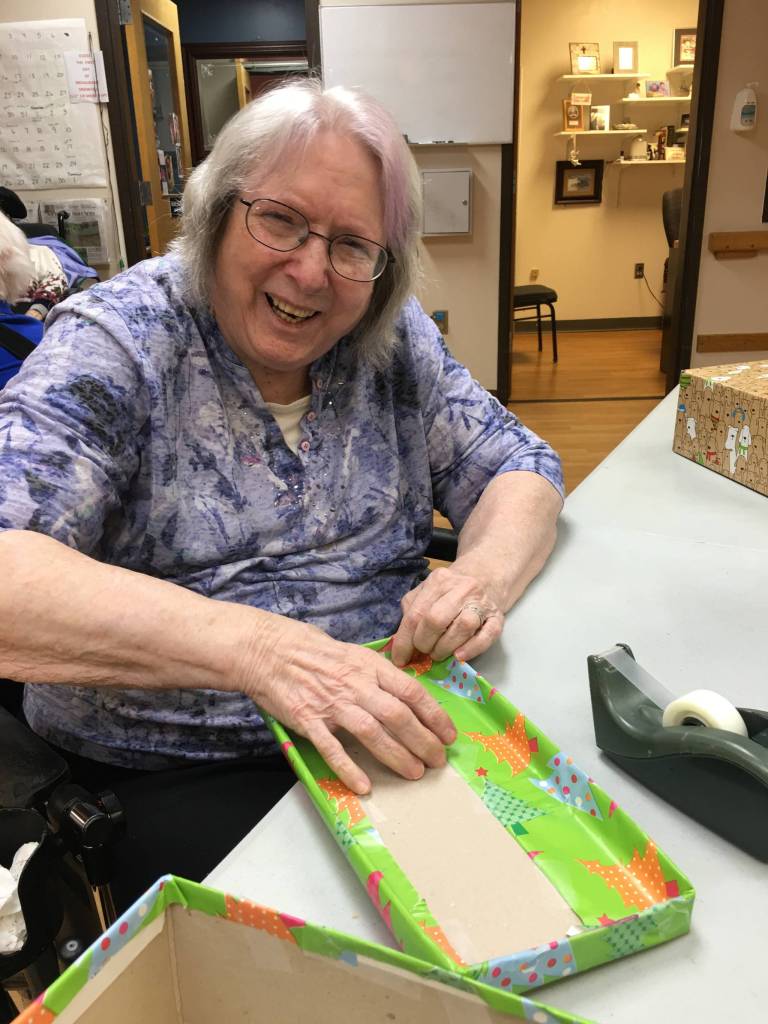 Heritage Place residents wrap holiday boxes with Samaritan’s Purse