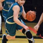 Nikiskis Bethany Carstens (right) dodges Barrow defender Jordan Ahgeak in the second half of a quarterfinal contest March 22, 2018, at the Class 3A state tournament at the Alaska Airlines Center. (Photo by Joey Klecka/Peninsula Clarion)