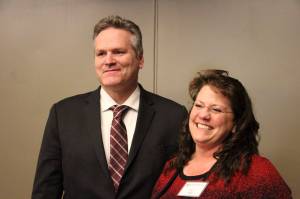 Alaska Gov.-elect Mike Dunleavy, left, poses with Corri Feige, whom Dunleavy named Wednesday, Nov. 14, 2018, during a speech in Anchorage, Alaska, as his commissioner of Natural Resources. Feige has spent her career working in the energy sector, including as a geophysicist and consultant and in management-level positions. (AP Photo/Mark Thiessen)