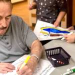 Students work with Heritage Place residents to spread Thanksgiving cheer