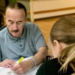 Students work with Heritage Place residents to spread Thanksgiving cheer