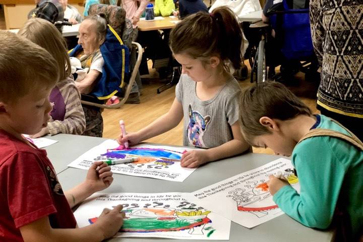 Students work with Heritage Place residents to spread Thanksgiving cheer