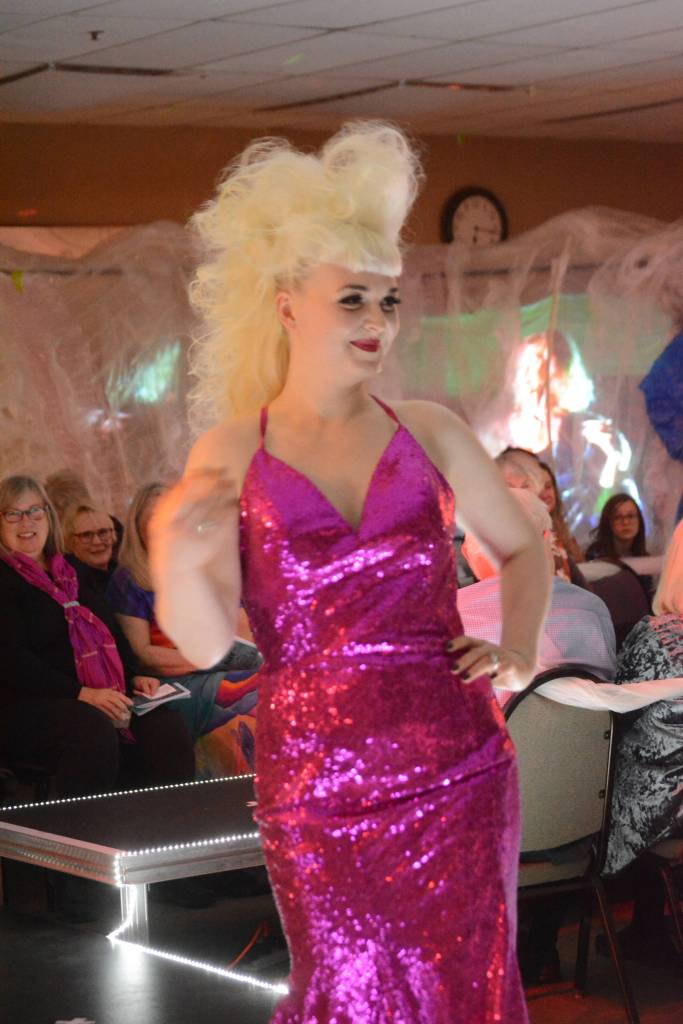 Bobbye Hurd wears a 1980s era dress by Lila Johnson at the 2018 Wearable Arts on Nov. 17, 2018, in Homer, Alaska. (Photo by Michael Armstrong/Homer News)