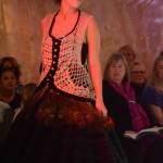 Rebeka Tufares models Feathers and Hoops by Lila Johnson at the 2018 Wearable Arts on Nov. 17, 2018, in Homer, Alaska. (Photo by Michael Armstrong/Homer News)