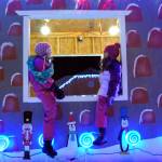 Sienne Lautarette, left, and Emma Glassmaker welcomed Christmas to Kenai at 2017s Christmas Comes to Kenai celebration at the Kenai Visitor Center. The evening festivities included an electric light parade, a fireworks show and snacks. (Photo by Kat Sorensen/Peninsula Clarion)