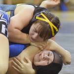 Homers McKenzie Cook controls Soldotnas Amanda Wylie at 152 pounds Tuesday, Nov. 27, 2018, at Soldotna Prep. Cook would pin Wylie. (Photo by Jeff Helminiak/Peninsula Clarion)
