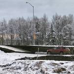 A car is trapped on a collapsed section of the offramp off of Minnesota Drive in Anchorage, Friday, Nov. 30, 2018. Back-to-back earthquakes measuring 7.0 and 5.8 rocked buildings and buckled roads Friday morning in Anchorage, prompting people to run from their offices or seek shelter under office desks, while a tsunami warning had some seeking higher ground. (AP Photo/Dan Joling)