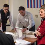 Alaska House District 1 candidate Democrat Kathryn Dodge, right, watches the election recount at the Department of Elections Juneau office on Friday, Nov. 30, 2018. A single mystery ballot found on a precinct table on Election Day but not counted then could decide a tied Alaska state House race and thwart Republican efforts to control the chamber and all of state government. The ballot arrived in Juneau last Friday in a secrecy sleeve in a bin with other ballot materials. Officials were investigating its origins and handling before deciding whether to tally it. (Michael Penn/The Juneau Empire via AP)