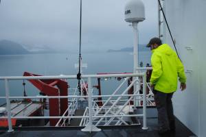 The R/V Sikuliaqs Third Mate Arthur Levine scans the entire vessel on Nov. 27 for safety concerns before the ship departs for Seattle via the Gulf of Alaska. (Photo by Kat Sorensen/Peninsula Clarion)