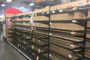 Empty shelves where bread is normally located are shown at a grocery store in Anchorage, Alaska, on Sunday, Dec. 2, 2018, two days after a magnitude 7.0 earthquake was centered about 7 miles north of the city. Anchorage officials urged residents not to stock up and hoard supplies because the supply chain of goods was not interrupted. (AP Photo/Mark Thiessen)