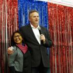 In this Nov. 4, 2018 file photo, Alaska Republican gubernatorial candidate Mike Dunleavy stands with his wife, Rose, on stage during a GOP rally in Anchorage, Alaska. Alaska Gov.-elect Mike Dunleavy takes office Monday, Dec. 3, days after a magnitude 7.0 earthquake rocked heavily-populated south-central Alaska. (AP Photo/Becky Bohrer, File)