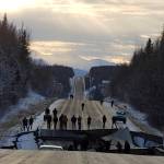 In this Nov. 30, 2018 file photo, provided by Jonathan M. Lettow, people walk along Vine Road after an earthquake in Wasilla, Alaska. Alaska State Troopers are asking that people do not take selfies in front of the buckled roadway north of Anchorage, Alaska. (Jonathan M. Lettow via AP, File)