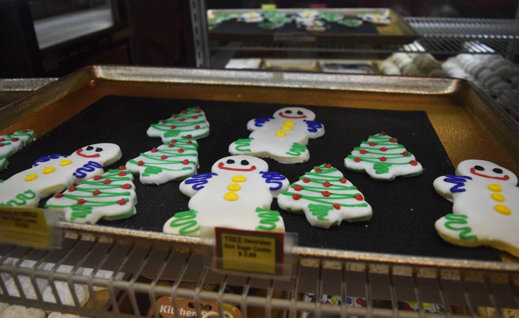 A pan of holiday-themed cookies sit in the window Tuesday afternoon at the Moose is Loose bakery in Soldotna. (Photo by Joey Klecka/Peninsula Clarion)