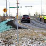 A car ascends a newly repaired off-ramp of Minnesota Drive on Wednesday, Dec. 5, 2018, in Anchorage, Alaska. A massive 7.0 earthquake and its aftershocks rocked buildings and buckled roads Nov. 30, including the road thats a route to Ted Stevens Anchorage International Airport. Alaska transportation officials made rebuilding the ramp a priority. It reopened Tuesday, Dec. 4, and a crew completed shoulder work Wednesday. (AP Photo/Dan Joling)