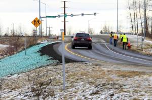 A car ascends a newly repaired off-ramp of Minnesota Drive on Wednesday, Dec. 5, 2018, in Anchorage, Alaska. A massive 7.0 earthquake and its aftershocks rocked buildings and buckled roads Nov. 30, including the road thats a route to Ted Stevens Anchorage International Airport. Alaska transportation officials made rebuilding the ramp a priority. It reopened Tuesday, Dec. 4, and a crew completed shoulder work Wednesday. (AP Photo/Dan Joling)