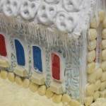 Jolly Rancher windows adorn the side of a gingerbread house entry by Christine Smith in the Kenai Chamber of Commerce and Visitor Center gingerbread house contest. The gingerbread houses will be on display until Dec. 21 in the visitor center. (Photo by Joey Klecka/Peninsula Clarion)
