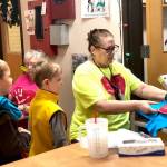 Residents from Heritage Place help kindergartner students make Dignity Mission T-shirts during a visit on Friday, Dec. 7, 2018, in Soldotna, Alaska. (Photo by Victoria Petersen/Peninsula Clarion)