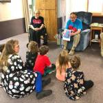 During Fridays Dignity Mission, residents of Heritage Place read to kindergartners from K-Beach Elementary, on Dec. 7, 2018, in Soldotna, Alaska. (Photo by Victoria Petersen)