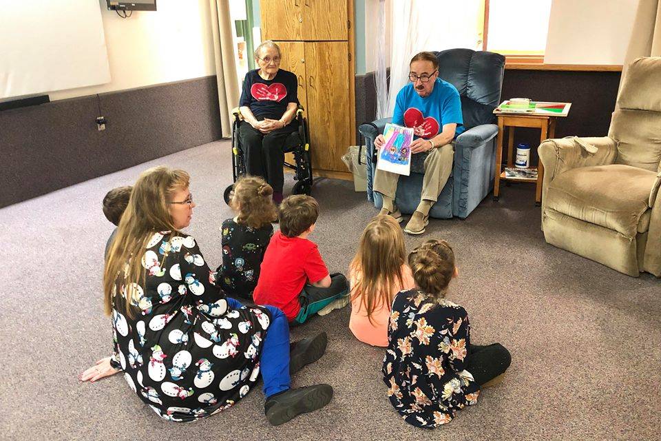 During Fridays Dignity Mission, residents of Heritage Place read to kindergartners from K-Beach Elementary, on Dec. 7, 2018, in Soldotna, Alaska. (Photo by Victoria Petersen)