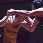 Homers Mariah Grimes (left) battles Redingtons Twyla Anderstrom for the girls 160-pound title Saturday at the Kachemak Conference wrestling tournament at Grace Christian High School in Anchorage. (Photo by Joey Klecka/Peninsula Clarion)