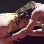 Voznesenkas Anthony Kalugin locks horns with Eliot Merriner of Grace Saturday in the 171-pound championship at the Kachemak Conference wrestling tournament at Grace Christian High School in Anchorage. (Photo by Joey Klecka/Peninsula Clarion)