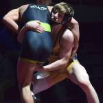 Homers Wayne Newman gains an advantage on Redingtons Gavin Metcalf Saturday in the 140-pound championship at the Kachemak Conference wrestling tournament at Grace Christian High School in Anchorage. (Photo by Joey Klecka/Peninsula Clarion)