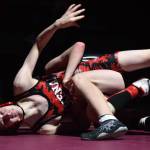 Kenai Central wrestler Talon Whicker fights against Nikiskis Griffin Gray Saturday at the Kachemak Conference wrestling tournament at Grace Christian High School in Anchorage. (Photo by Joey Klecka/Peninsula Clarion)