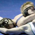 Soldotnas Gideon Hutchison works to get near fall points against Colonys Kayden Payne in the 130-pound final of the Northern Lights Conference meet Saturdy at Palmer High School. (Photo by Jeremiah Bartz/Frontiersman)