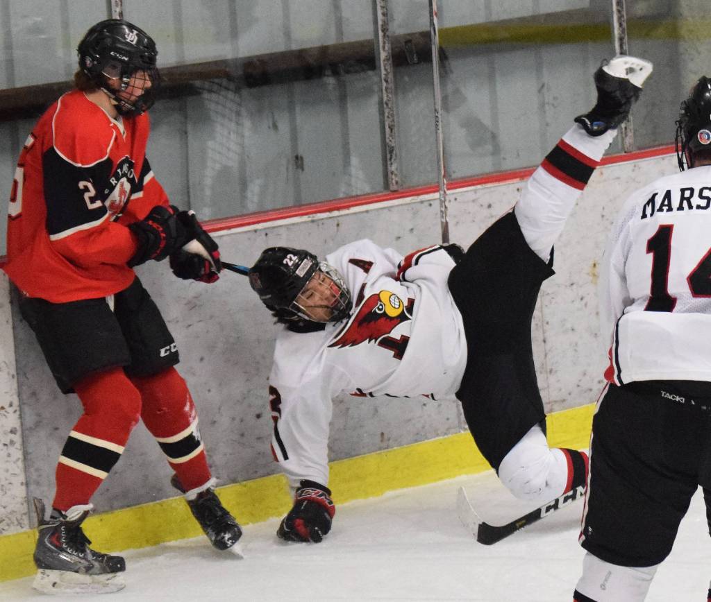 Kenais Jacob Keels takes a spill Wednesday night against Juneau-Douglas at the Kenai Multi-Purpose Facility. (Photo by Joey Klecka/Peninsula Clarion)