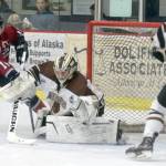 Kenai River Brown Bears goaltender Gavin Enright denies Fairbanks Ice Dogs forward Parker Brown on Sunday, Nov. 25, 2018, at the Soldotna Regional Sports Complex. (Photo by Jeff Helminiak/Peninsula Clarion)