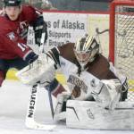 Kenai River Brown Bears goaltender Gavin Enright denies Fairbanks Ice Dogs forward Parker Brown on Sunday, Nov. 25, 2018, at the Soldotna Regional Sports Complex. (Photo by Jeff Helminiak/Peninsula Clarion)