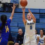 Soldotnas Brittani Blossom launches a 3-point shot Friday night over Kodiak defender Lisa Marcelo at the Powerade/Al Howard Tip-Off tournament at Soldotna. (Photo by Joey Klecka/Peninsula Clarion)