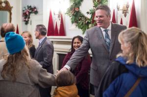 Gov. Mike Dunleavy and his wife, Rose, welcome Juneau residents at the Governors Open House on Tuesday. (Michael Penn | Juneau Empire)