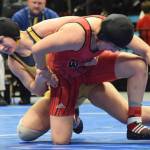 Homers McKenzie Cook battles against Eielsons Nailah Bealer (right) in the girls 145-pound final Saturday night at the girls state wrestling championships at the Alaska Airlines Center in Anchorage. (Photo by Joey Klecka/Peninsula Clarion)