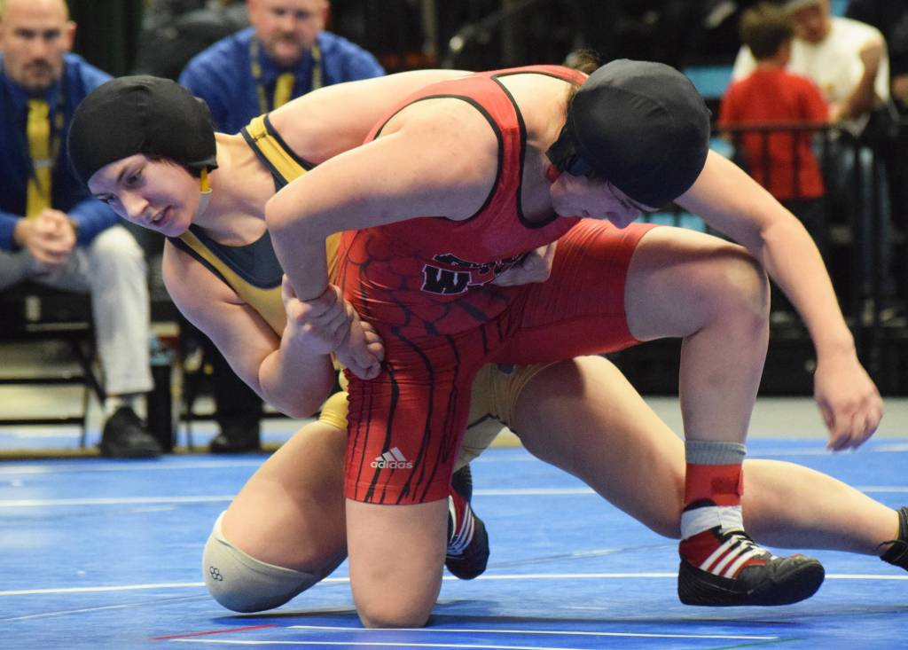 Homers McKenzie Cook battles against Eielsons Nailah Bealer (right) in the girls 145-pound final Saturday night at the girls state wrestling championships at the Alaska Airlines Center in Anchorage. (Photo by Joey Klecka/Peninsula Clarion)