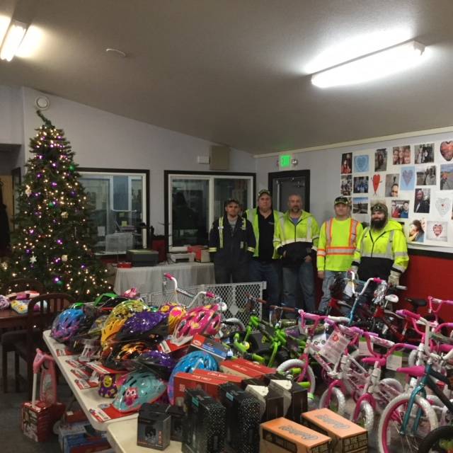 Alaska Waste employees show off their handiwork. (Photo courtesy of Alaska Waste)