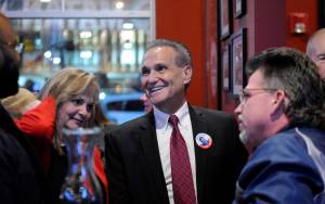 Lt. Gov. Kevin Meyer, R-Anchorage, center, talks with supporters in Anchorage on Nov. 6. Meyer is calling or an audit of Alaskas election system. (Photo/Michael Dinneen/AP)